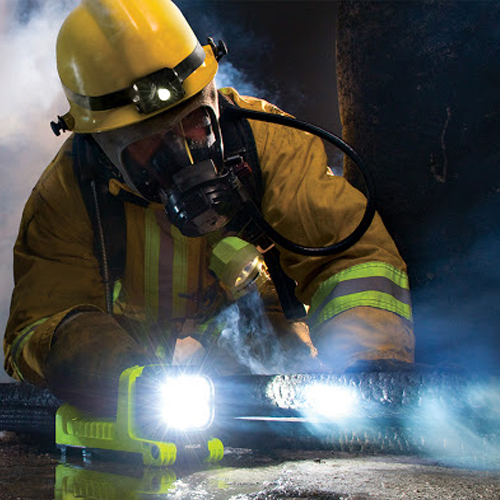 Peli Atex portable lighting system used by a firefighter in an intervention.