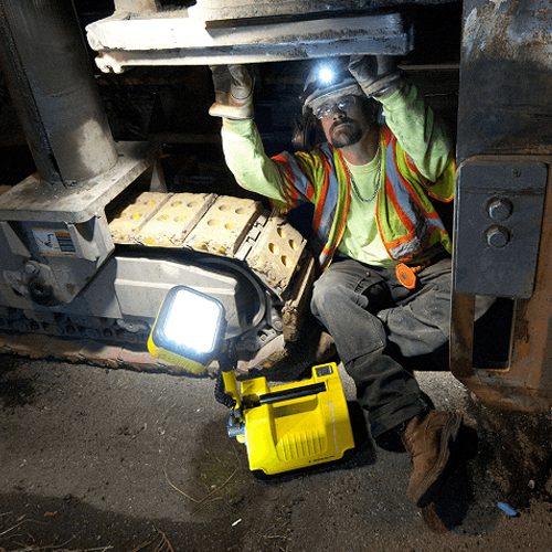 Peli Rals portable lighting system used by a worker in a factory.